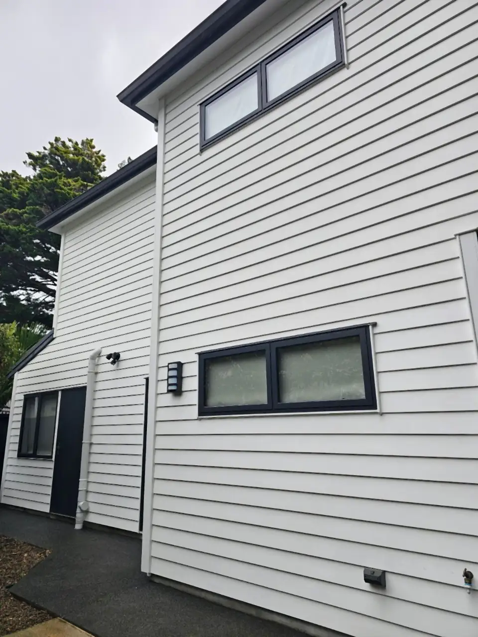 After: The same house bright white again